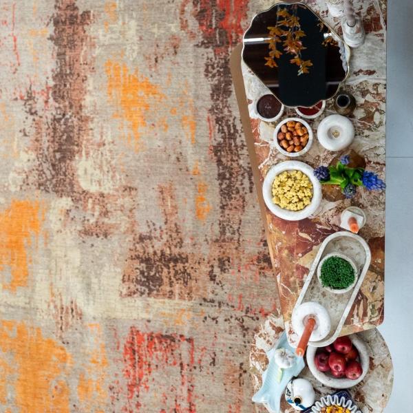 Nowruz table with colourful eggs on oriental carpet