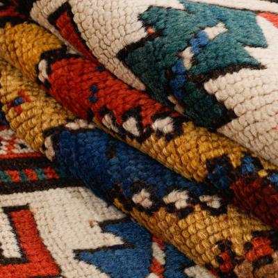Close-up of hand-knotted Kazak antique Genje carpet