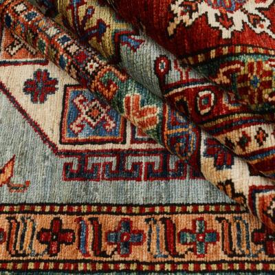Detailed view of a hand-knotted Super Kazak, in the style of Caucasian carpets.