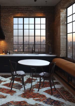 Modern rug in vintage art style under a dining table in the loft